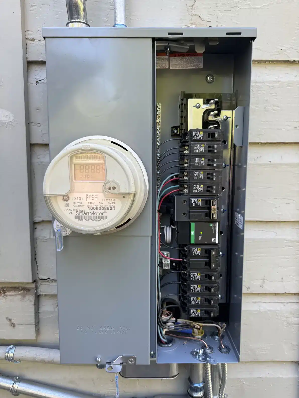 Inside of a new meter-main electrical panel showing breakers and wiring in Fresno, CA